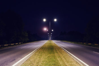 A photo of street lights on a two-way road